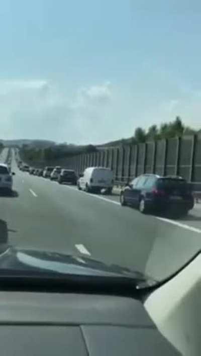 People leave space in the middle during traffic on the Autobahn so emergency vehicles can get through directly