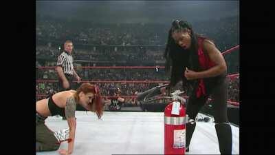 Jacqueline looks like a fool trying to operate a fire extinguisher, completely forgetting about Lita, and paying for it dearly