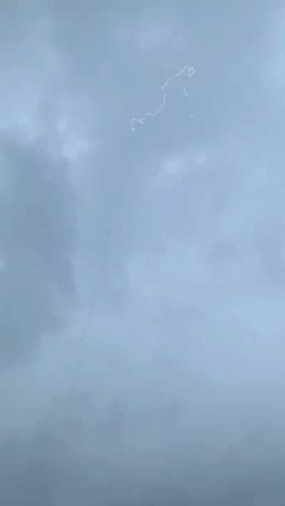 Lightning Bolt Is Guided to Ground Through Rocket Trail