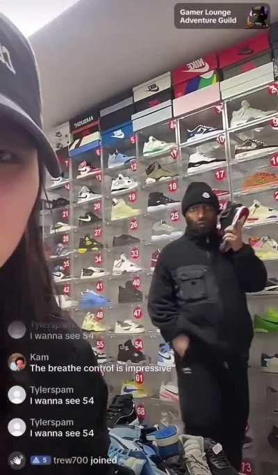 Couple trying to sell fake sneakers as one wears an interesting mask