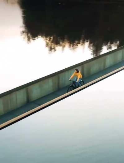 Riding bike through a body of water