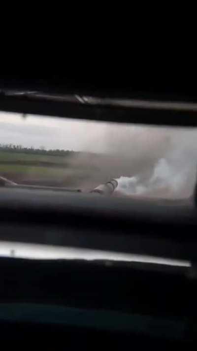 Ukrainian tank at work blasting Russian targets with shells in eastern Ukraine. The view of a tank crew in action.