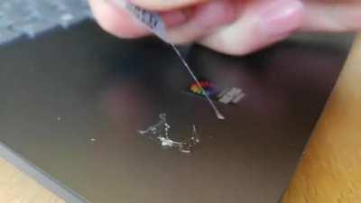 Removing the glue residue from a sticker