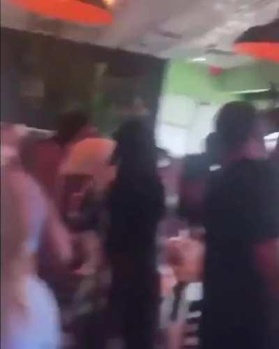 Women twerking at a restaurant