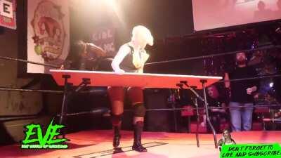 Rhia O'Reilly has Ayesha Raymond lose her balance to then put her through a table