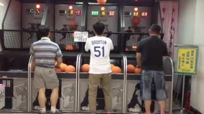 Guy on the left is insane at arcade basketball