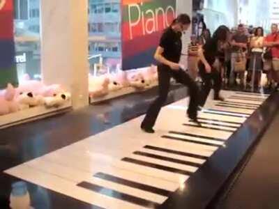 These Girls Toccatad And Fugued On A Floor Piano.