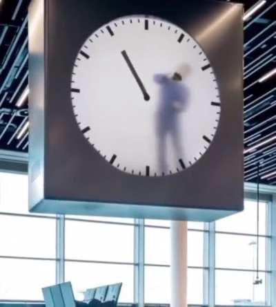 This clock at Amsterdam Schiphol Airport features a 12-hour video of a man painstakingly painting the time minute by minute.