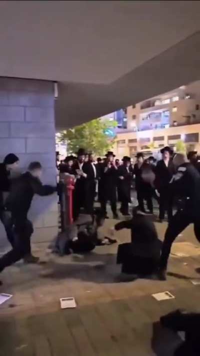 Israeli police officers beat a group of Haredim (ultra-Orthodox) demonstrating against conscription.