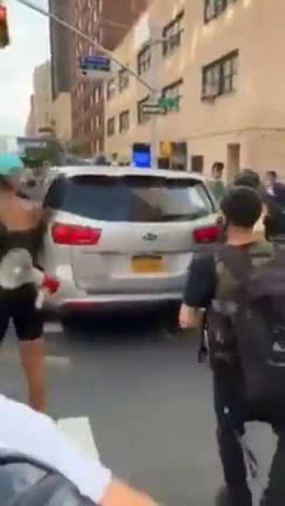 Protestor on skateboard is arrested by NYPD and put in an unmarked van