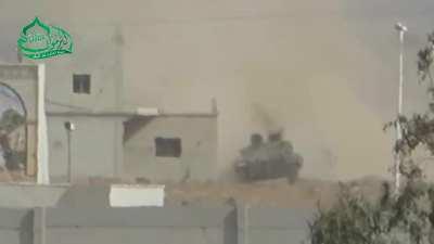 Yarmouk Army BGM-71 TOW team engages an SAA tank in the rear - Nassib Border Crossing - 10/18/2014