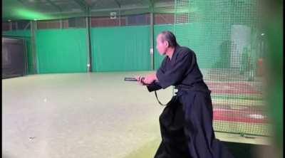 Grand Master of Yuwakai Karate, Yuetsu Suzuki, demonstrates his impeccable skill with a sword to slice a 160 km/h fastball fired towards him.