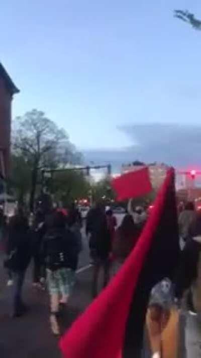 Passerby Bostonians honking their horns in support of revolutionary May 1st 2021 liberation march through the city of Boston. Colonizer statues vandalized.