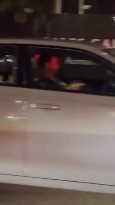 Mom gives Dad a blowjob in traffic while the kids play on their phones in the back