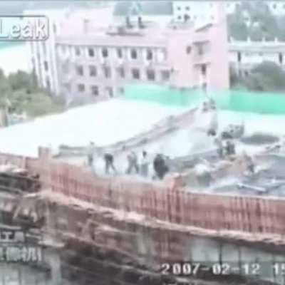 Chinese workers fall into building as the roof collapses. 2007-02-12