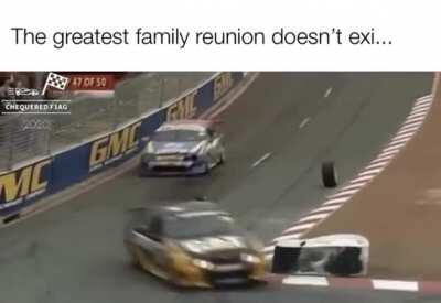 A loose tyre from a racecar goes on top of a crash barrier smoothly.