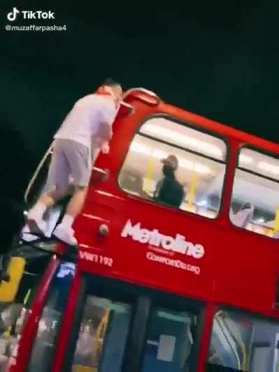 After a successful game, an English football fan catches the bus home