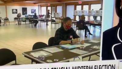 man in mask marking ballots caught on video