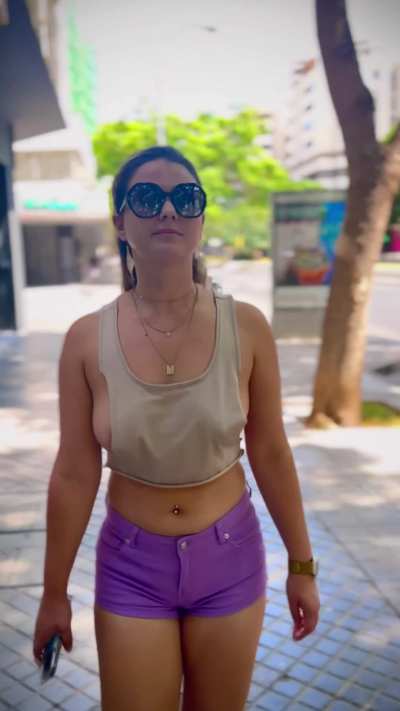 Braless in top too small to cover Tits walking in the street.