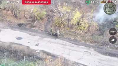 Two Ukrainians abandon their wounded comrade.