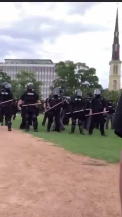 Police arrest a peaceful protester, ignoring our right to free speech. This is not serving, this is not protecting.