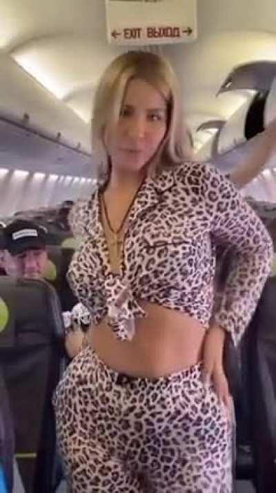 lady trying to make video on plane