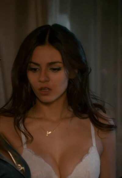 Victoria Justice with a sultry lip bite and her cleavage on display