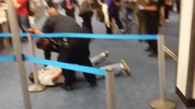 Airport biggot gets wrangled at Dallas Airport when cowboy comes to the rescue. 