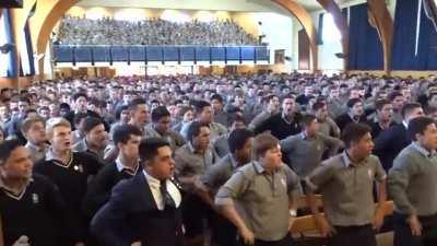 New Zealand school boys perform a blood chilling haka for their retiring teacher