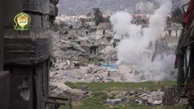 Al-Rahman recoiless team engages a building anchoring an SAA sandbagged position - Jobar, Damascus - 5/11/2015