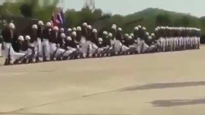 The way these men move like a wave.