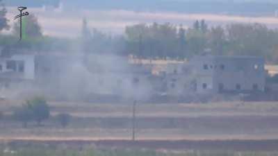 FSA BGM-71 TOW strike on a Syrian Tank exposed to fire - N. Hama Countryside - 9/18/2014