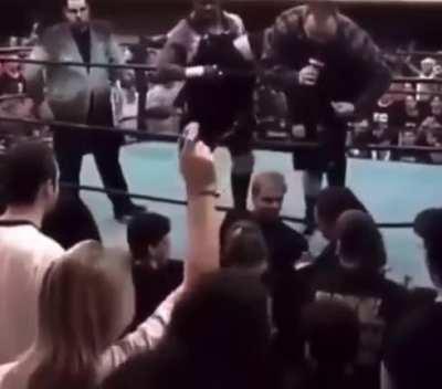 Fan gets kicked out of ECW show after booing while a 10 bell solute for Rick Rude