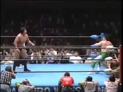 Misawa counters a Takayama big boot with a smooth flying elbow