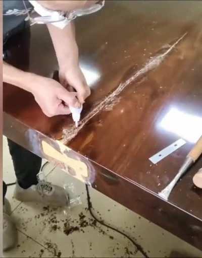 Repairing a large crack in a wooden table 