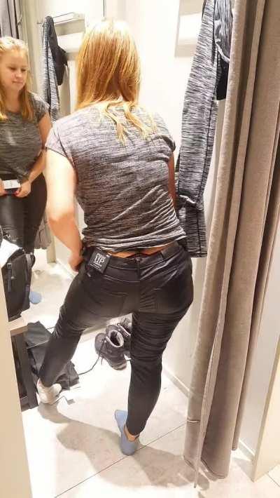 Note the big butt and massive thighs in the fitting room at the store, right next to a random guy.