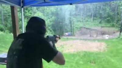 AK-47 muzzle blast deflecting rain .