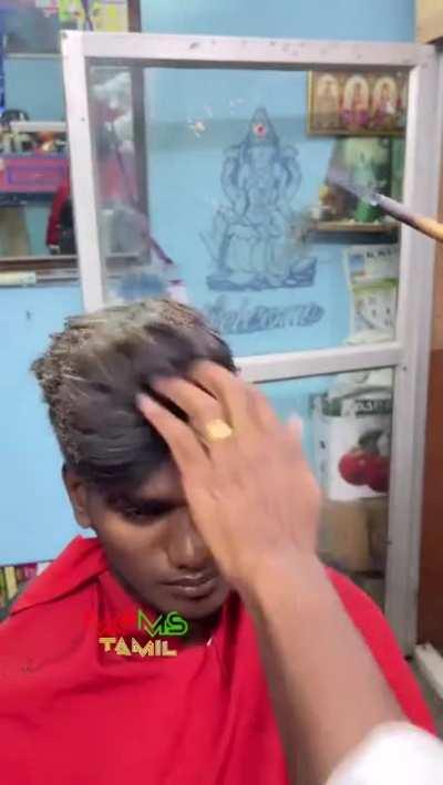 Barber burns hair for a specific look or hairstyle 