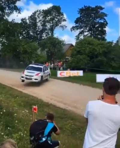 Jump drift in a Mitsubishi Lancer in a rally race.