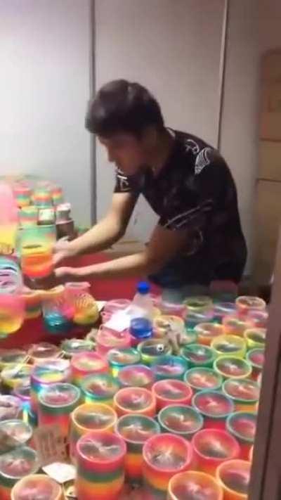 This guy knows how play with Slinky Rainbow toy