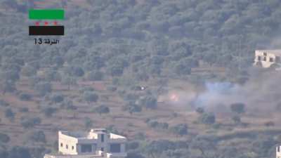 FSA 13th Division BGM-71 TOW strike sends an SAA tank's barrel spinning in a catastrophic hit - Jericho, Idlib - 5/4/2015