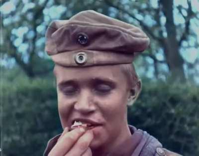 An unknown young soldier grins and laughs on the last day of WWI.