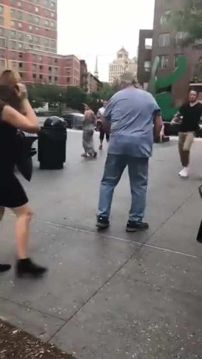 Guy tells lady to pick up her dogs poop lady gets mad and throws the poop at the guy