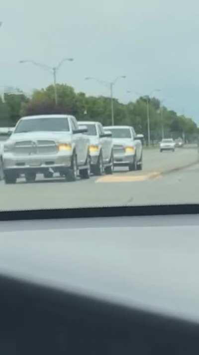 3 of the same cars in the same lane with synchronized blinkers.