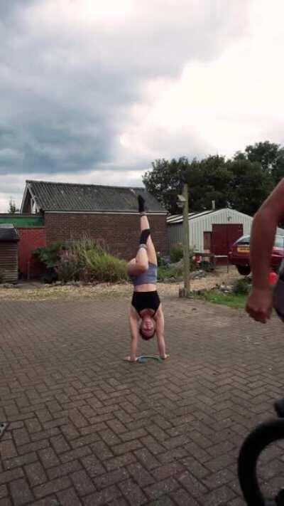 Boyfriend jumps over me on his unicycle, while I do a handstand