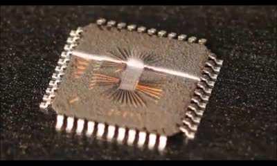 Semiconductor being decapped by lasers