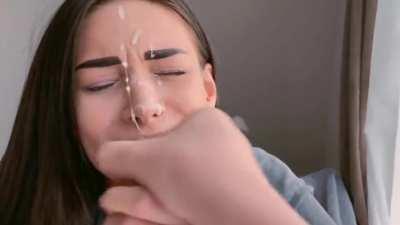 Cumshot on her beautiful face