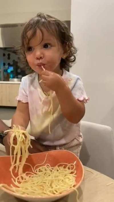 my daughter reaction to trying fresh pasta in Italy