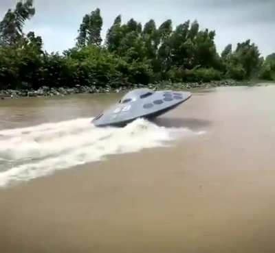 A Vietnamese YouTuber Thánh Chế casually launching his UFO shaped boat into the river