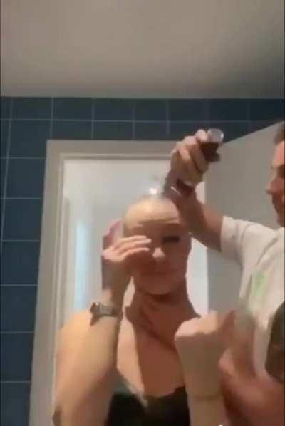 He shaves his head to show support for her